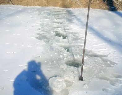 Ice measurement at Turkey Creek near Seneca, KS on Jan. 9, 2015. Photo by Dirk Hargadine, USGS.