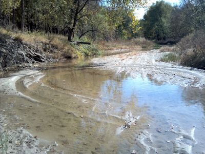 0.72 cfs at North Fork Solomon River at Glade, KS on Oct. 10, 2012. Photo by Lori Marintzer, USGS.