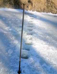 Ice measurement at Soldier Creek near Delia, KS on Jan. 9, 2015. Photo by Dirk Hargadine, USGS.