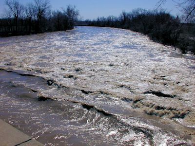 11,600 cfs at Neosho River near Iola, KS on Mar. 11, 2004. Photo by Brian Loving, USGS.